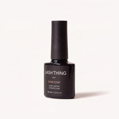 Lashthing Nail Basecoat 8 ml, zwart flesje met roségouden BASE COAT-label, schuin vooraanzicht